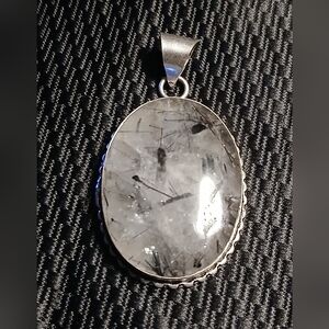 Elegant Silver Pendant with Black and White Stone